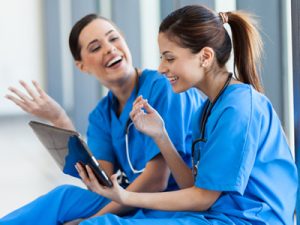 Travel nurses laughing together, Travel Nurse Tips From Recruiters